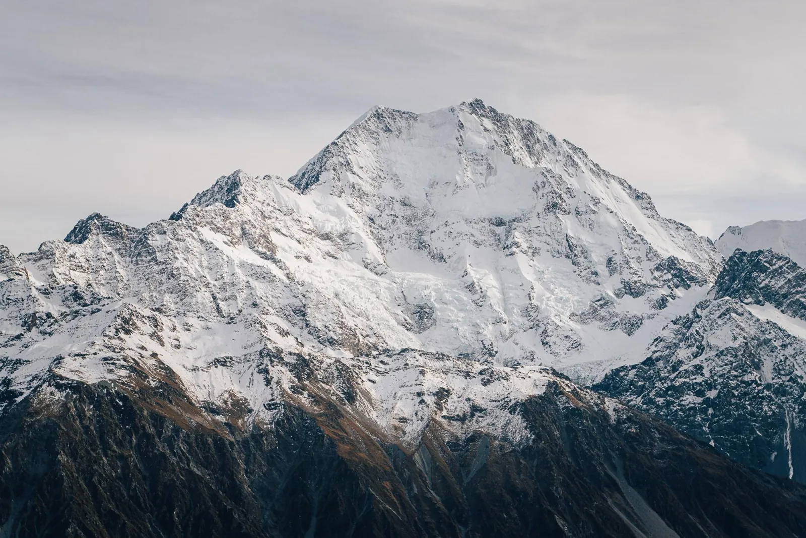 Snow-covered peak of the Southern Alps seen close up from the helicopter