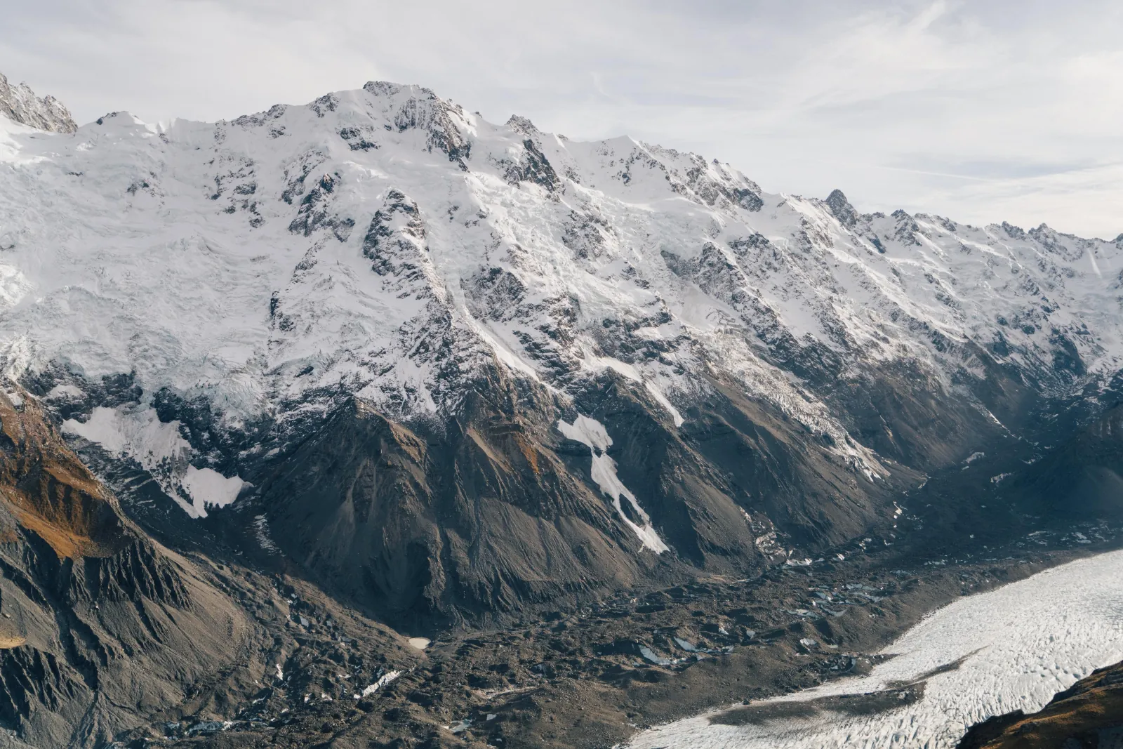 Snow-covered range above the rubble-strewn lower Tasman Glacier